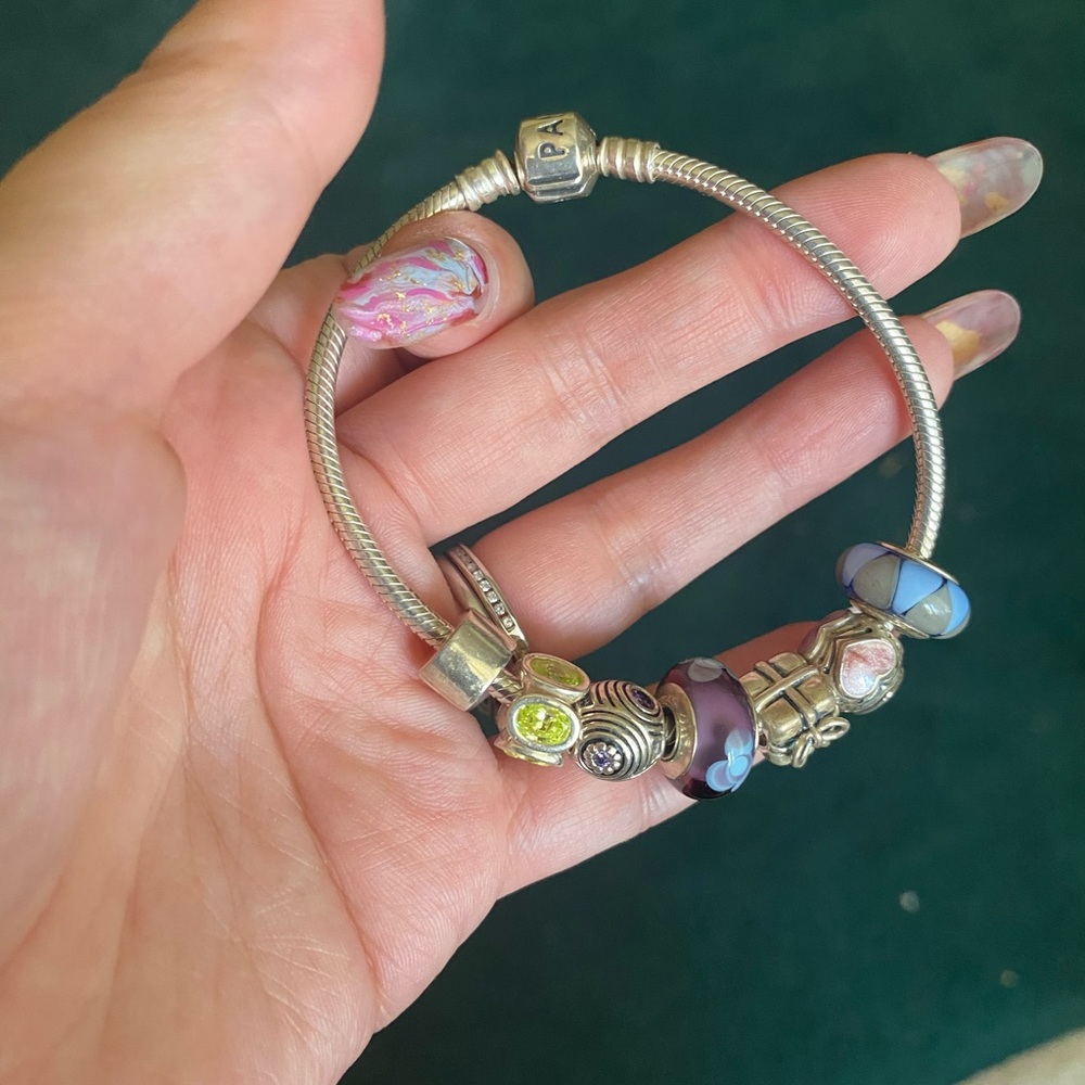 Pandora bracelet with 7 charms.